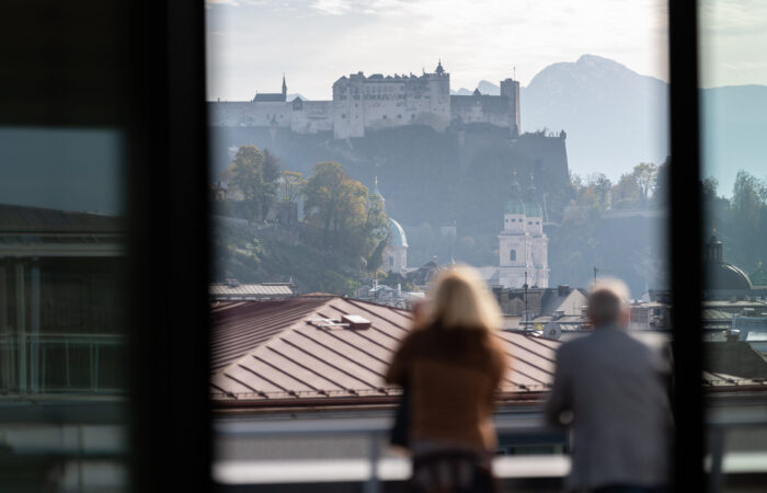 man-and-woman-enjoying-the-view-in-salzburg-2025-03-09-17-13-10-utc
