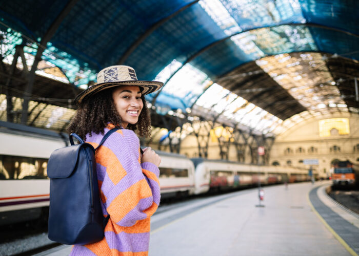 young-black-woman-traveler-with-backpack-and-hat-a-2025-01-08-09-03-16-utc