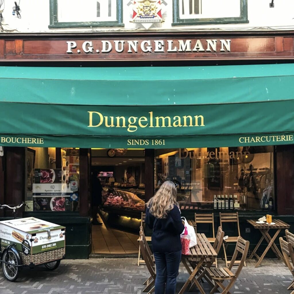 Dungelmann. ©JennyHuttinga Dungelmann butcher shop storefront with green awning in The Hague.